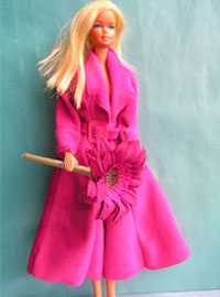 Barbie doll with a Barbie pink coat