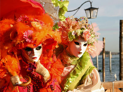 Pair of costumed and masked party-goers at the Carnival of Venice