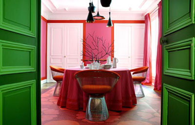Home of interior designer Christophe d'Aboville in Paris with bright pink walls and green doors