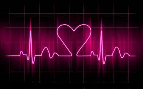 Neon pink sign with a heart