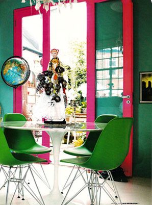 Home of fashion designer Matthew Williamson with green walls and bright pink doors